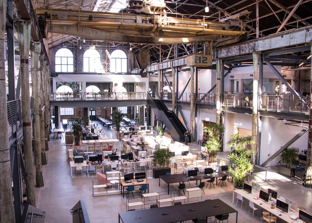 Inside Gusto's San Francisco headquarters, an open workspace in a converted industrial building.