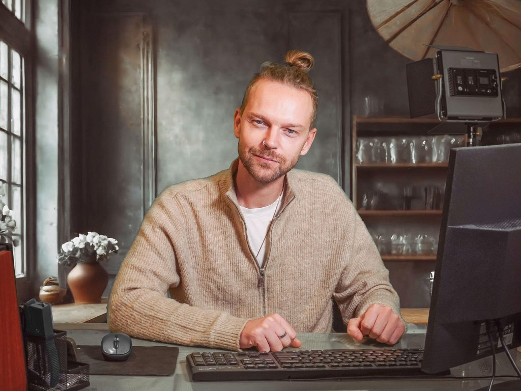 Man, desk, computer, and adult