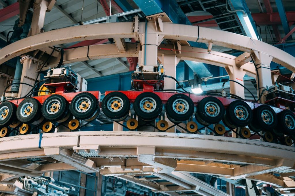 Large industrial machinery fills a factory interior