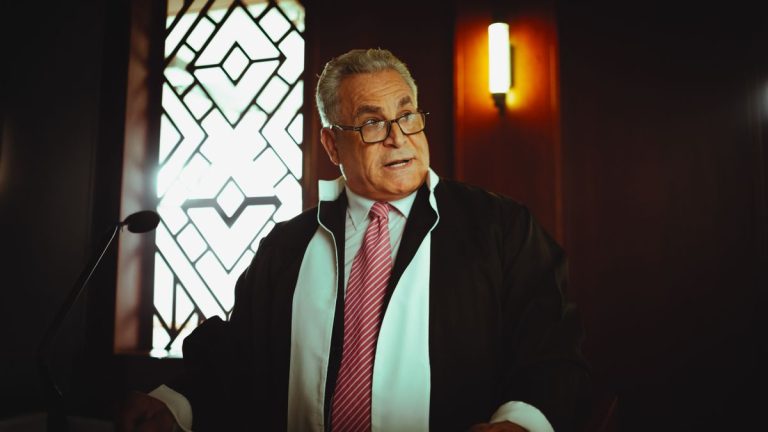 Middle-Eastern judge wearing traditional attire in a courtroom, Baghdad, Iraq
