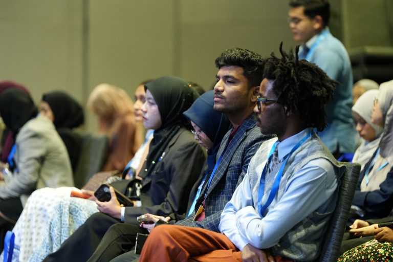Conference audience seated indoors